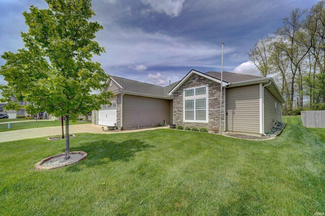 1592 Breckenridge Pass, Fort Wayne, IN 46845 - view of front of property with stone siding, a garage, a front yard, and driveway