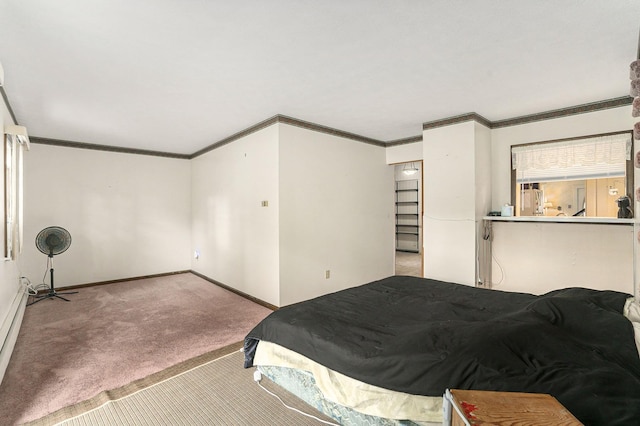bedroom with carpet, baseboards, and crown molding