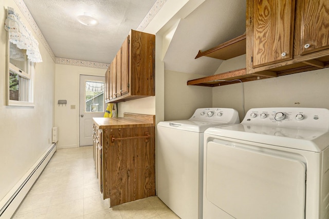laundry room with a baseboard heating unit and independent washer and dryer