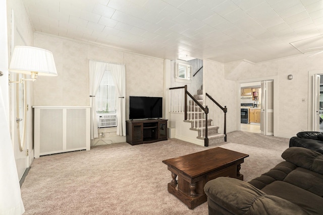 living room with carpet, stairway, and crown molding