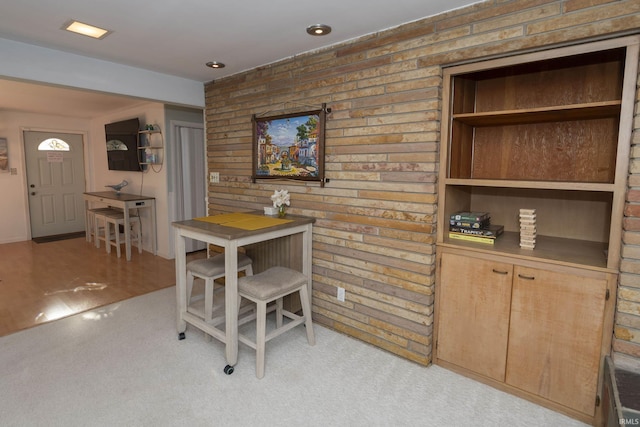 dining area with light colored carpet