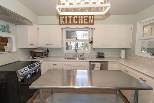 kitchen with stainless steel appliances, a sink, white cabinetry, light countertops, and extractor fan