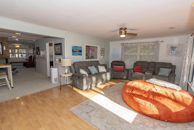 living area featuring ceiling fan and wood finished floors