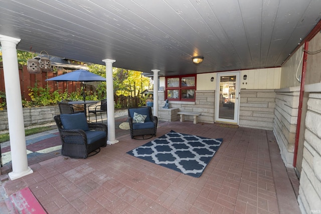 view of patio featuring fence
