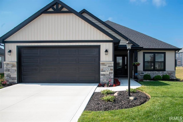 view of front of home featuring stone siding, concrete driveway, a front yard, a garage, and a shingled roof