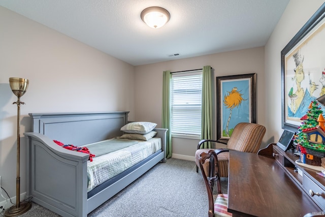 bedroom featuring carpet floors and baseboards