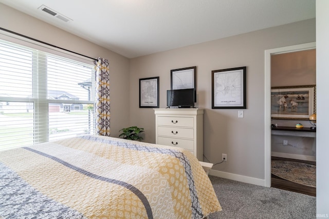 carpeted bedroom with baseboards