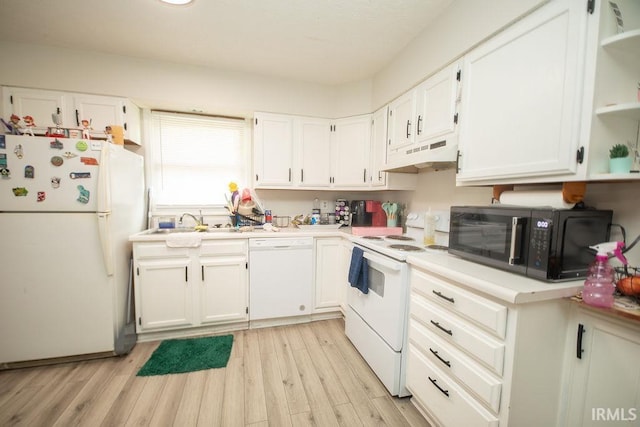 1831/1833 S Maxwell St, Bloomington, IN 47401 - kitchen featuring white appliances, under cabinet range hood, a sink, and white cabinets