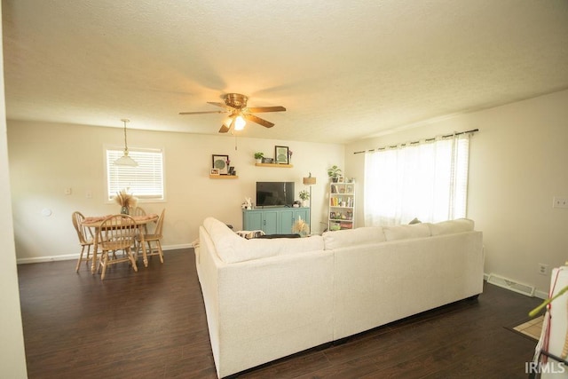 1831/1833 S Maxwell St, Bloomington, IN 47401 - living room featuring ceiling fan, dark wood-type flooring, baseboards, and a textured ceiling