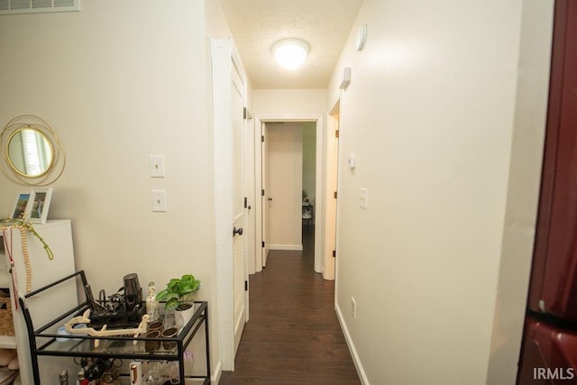 1831/1833 S Maxwell St, Bloomington, IN 47401 - hall featuring dark wood-style flooring and baseboards
