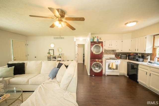 1831/1833 S Maxwell St, Bloomington, IN 47401 - living room with stacked washing machine and dryer, dark wood-style floors, a ceiling fan, and a textured ceiling