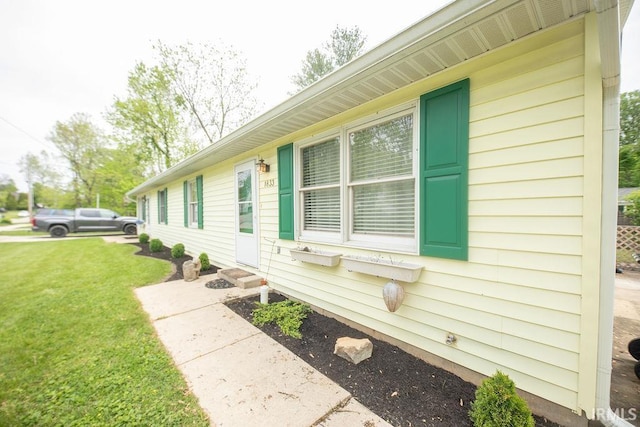 1831/1833 S Maxwell St, Bloomington, IN 47401 - view of side of home featuring a lawn and entry steps