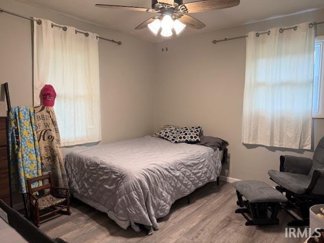 2823 Hillside Dr, Bedford, IN 47421 - bedroom featuring wood finished floors and a ceiling fan