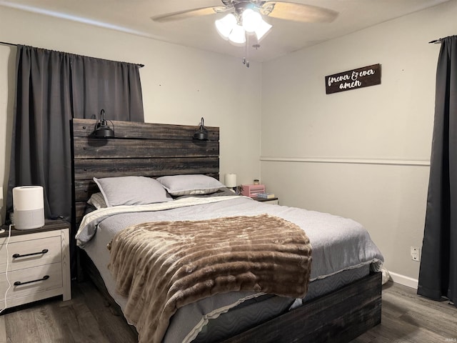 2823 Hillside Dr, Bedford, IN 47421 - bedroom featuring dark wood finished floors, ceiling fan, and baseboards