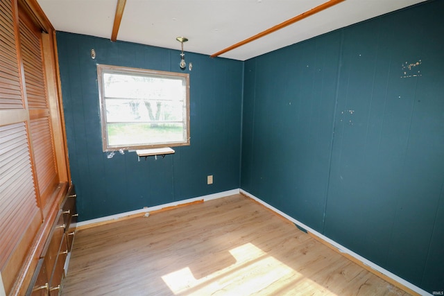 1008 W Elm St, Hartford City, IN 47348 - empty room featuring wood finished floors and baseboards