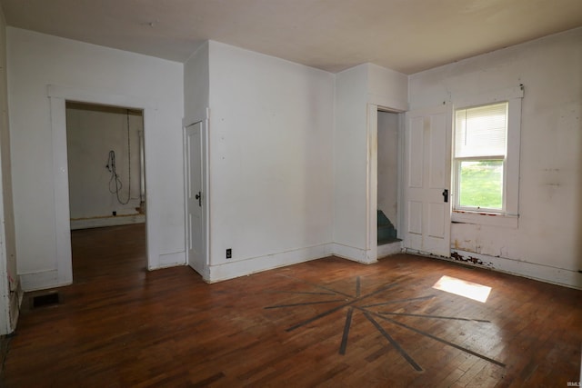 1008 W Elm St, Hartford City, IN 47348 - spare room with hardwood / wood-style flooring, stairs, and baseboards