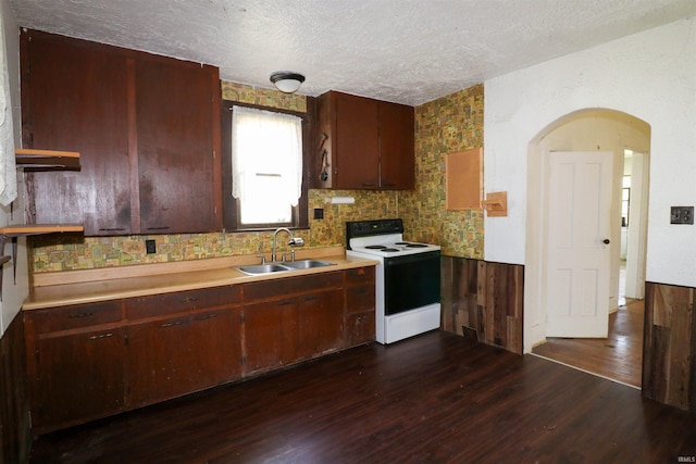 1008 W Elm St, Hartford City, IN 47348 - kitchen with electric range, a sink, a textured ceiling, dark wood finished floors, and light countertops