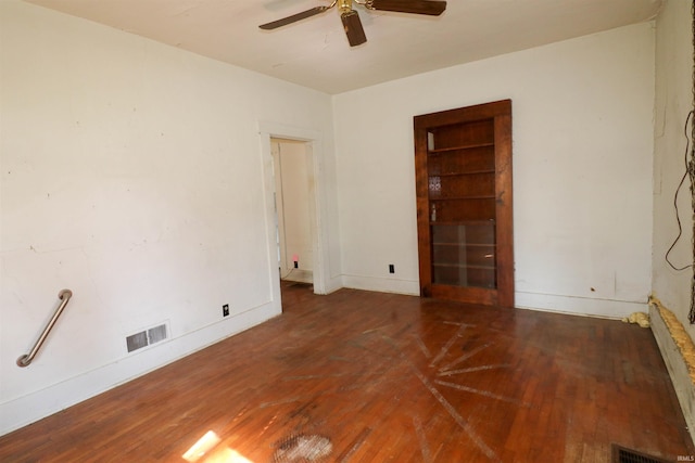 1008 W Elm St, Hartford City, IN 47348 - unfurnished room featuring wood finished floors, a ceiling fan, and baseboards