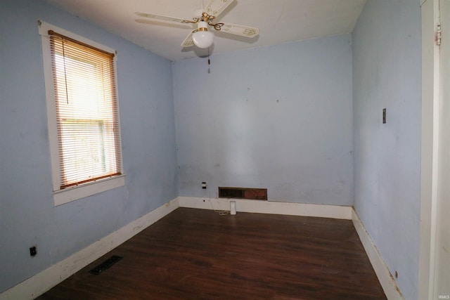 1008 W Elm St, Hartford City, IN 47348 - spare room featuring wood finished floors, plenty of natural light, baseboards, and a ceiling fan