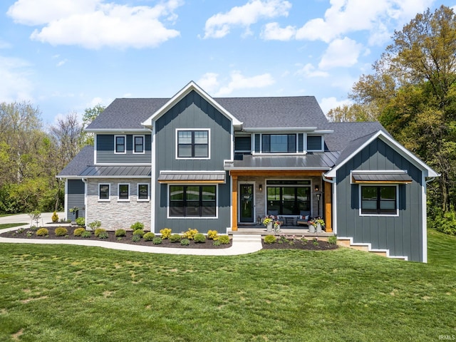 8086 Shepardson Creek Dr, Lafayette, IN 47905 - view of front of property with a standing seam roof, covered porch, a front lawn, and a shingled roof
