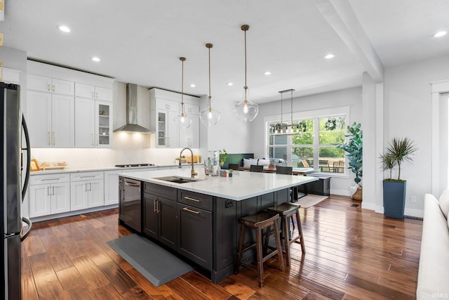 8086 Shepardson Creek Dr, Lafayette, IN 47905 - kitchen with wall chimney exhaust hood, a sink, freestanding refrigerator, white cabinets, and recessed lighting