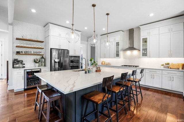 8086 Shepardson Creek Dr, Lafayette, IN 47905 - kitchen with stainless steel appliances, wine cooler, wall chimney range hood, decorative backsplash, and a sink