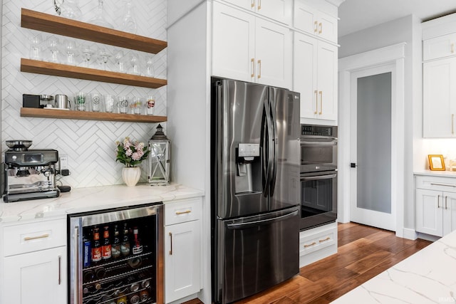 8086 Shepardson Creek Dr, Lafayette, IN 47905 - kitchen featuring appliances with stainless steel finishes, wine cooler, tasteful backsplash, dark wood-style floors, and white cabinetry