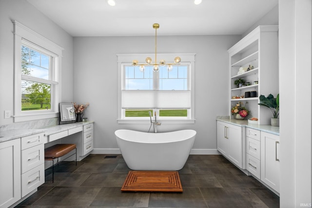 8086 Shepardson Creek Dr, Lafayette, IN 47905 - bathroom with a freestanding tub, vanity, recessed lighting, baseboards, and a chandelier