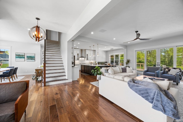 8086 Shepardson Creek Dr, Lafayette, IN 47905 - living area featuring a chandelier, dark wood finished floors, ceiling fan, stairway, and recessed lighting