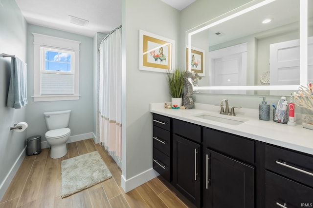 8086 Shepardson Creek Dr, Lafayette, IN 47905 - bathroom featuring wood finished floors, toilet, vanity, and baseboards
