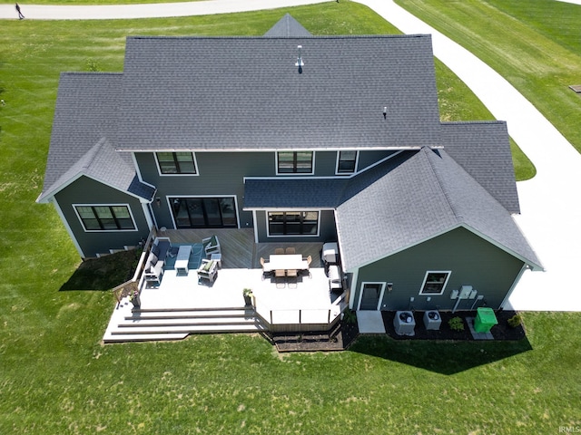 8086 Shepardson Creek Dr, Lafayette, IN 47905 - rear view of property with outdoor lounge area, a deck, a shingled roof, and a lawn