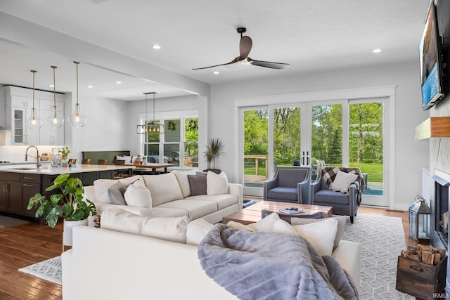 8086 Shepardson Creek Dr, Lafayette, IN 47905 - living room with wood finished floors, french doors, ceiling fan, a fireplace, and recessed lighting