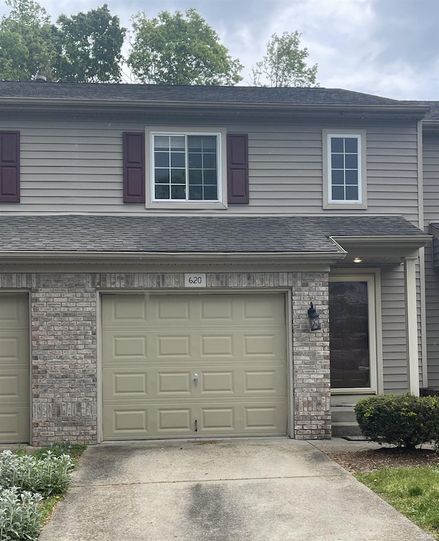 620 Bayberry Ct, Bloomington, IN 47401 - view of front of property with a garage and driveway