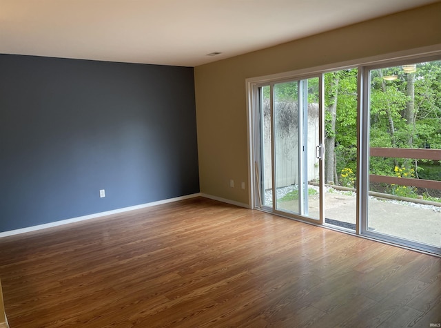 620 Bayberry Ct, Bloomington, IN 47401 - spare room featuring healthy amount of natural light, wood finished floors, and baseboards
