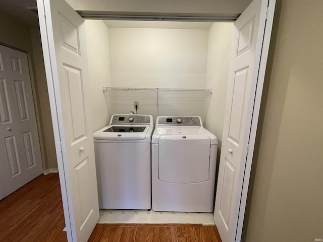620 Bayberry Ct, Bloomington, IN 47401 - laundry area featuring separate washer and dryer and light wood finished floors