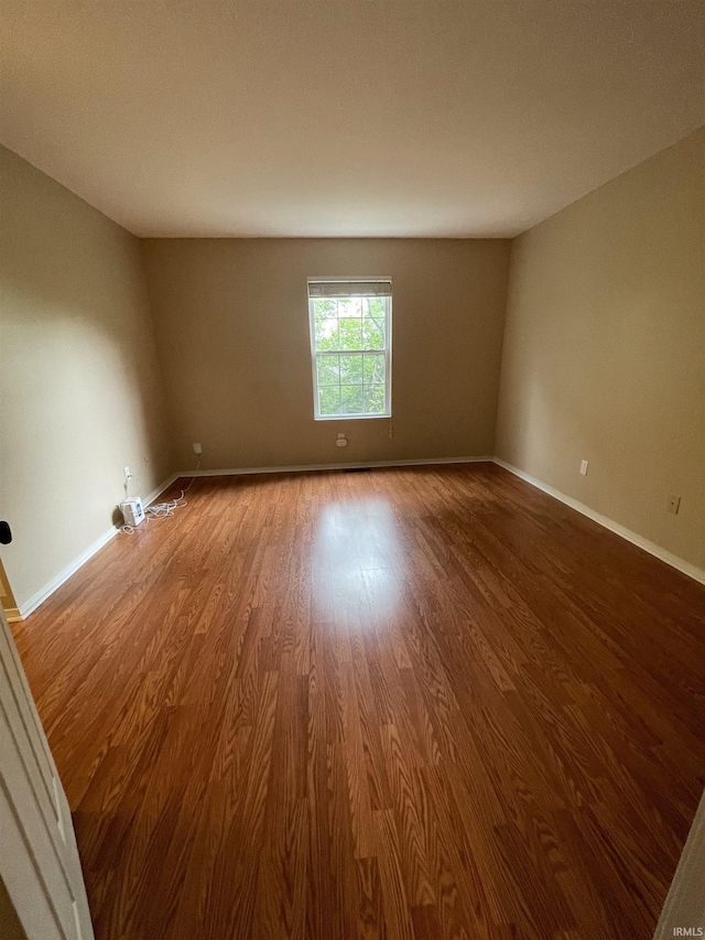 620 Bayberry Ct, Bloomington, IN 47401 - spare room featuring wood finished floors and baseboards