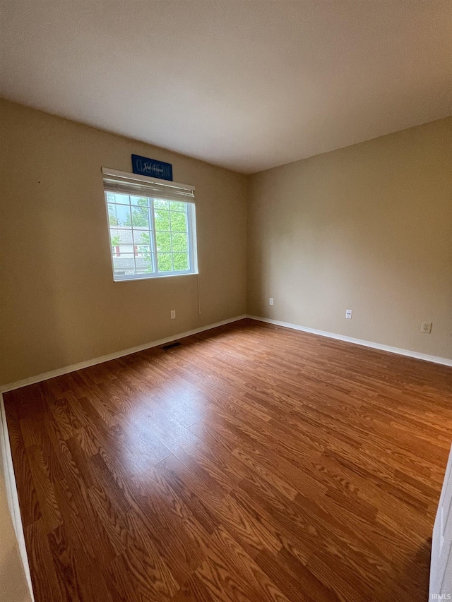 620 Bayberry Ct, Bloomington, IN 47401 - spare room with wood finished floors and baseboards