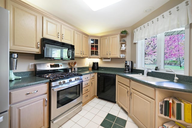 kitchen with black appliances, open shelves, dark countertops, light tile patterned floors, and a sink