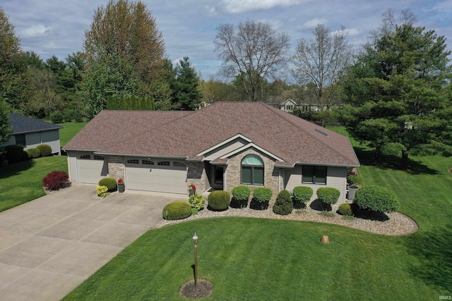 ranch-style house with concrete driveway, an attached garage, a front yard, and a shingled roof