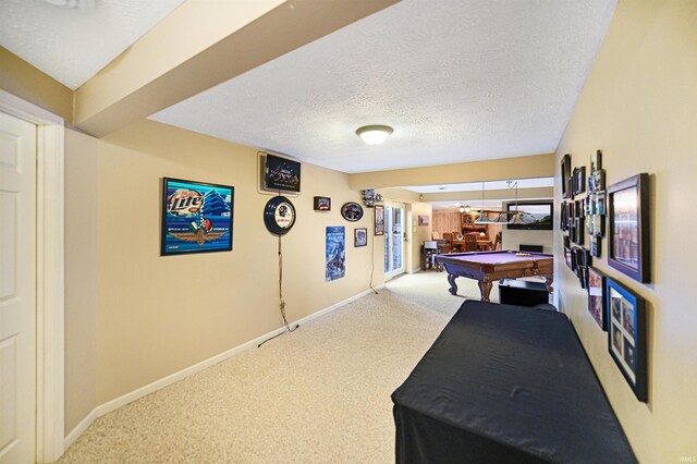 rec room featuring billiards table, carpet floors, baseboards, and a textured ceiling