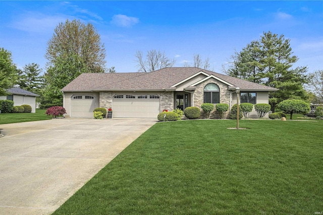 ranch-style home featuring a garage, a front yard, stone siding, and concrete driveway
