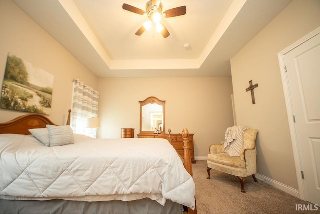 3417 S Tulip Ave, Bloomington, IN 47403 - bedroom with a tray ceiling, carpet, baseboards, and ceiling fan