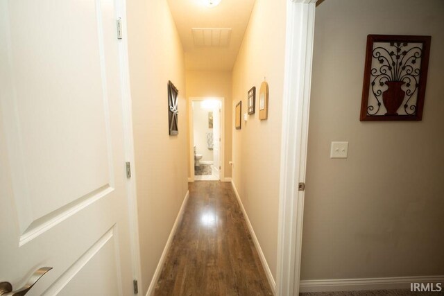 3417 S Tulip Ave, Bloomington, IN 47403 - hallway with dark wood-type flooring and baseboards