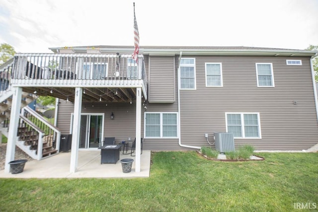 3417 S Tulip Ave, Bloomington, IN 47403 - back of house featuring a yard, central AC unit, stairs, and a patio