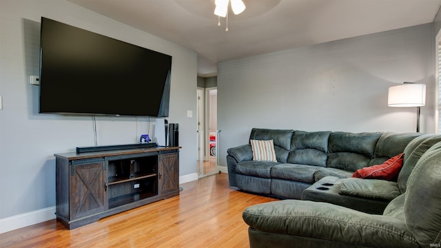 208 S Ohio St, Chandler, IN 47610 - living room featuring light wood-type flooring, ceiling fan, and baseboards