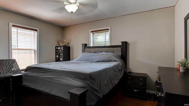 208 S Ohio St, Chandler, IN 47610 - bedroom with dark wood-style flooring, baseboards, and a ceiling fan