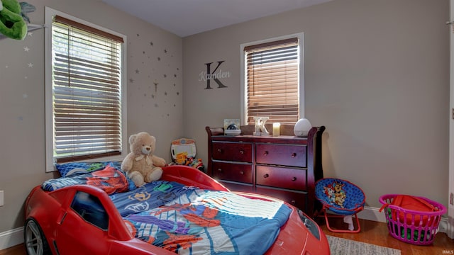 208 S Ohio St, Chandler, IN 47610 - bedroom with wood finished floors and baseboards
