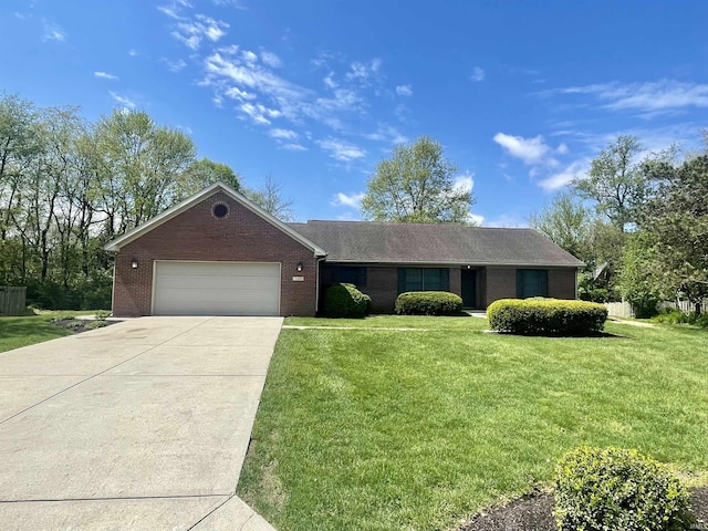 ranch-style house with a garage, concrete driveway, brick siding, and a front yard