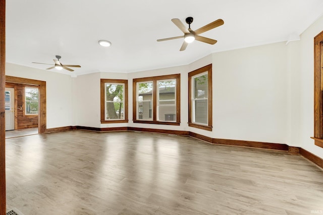 3910 E Bellefontaine Rd, Hamilton, IN 46742 - empty room featuring ceiling fan, wood finished floors, baseboards, and ornamental molding