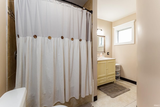 1026 N Michigan St, South Bend, IN 46617 - bathroom with tile patterned flooring, vanity, a shower with shower curtain, and toilet